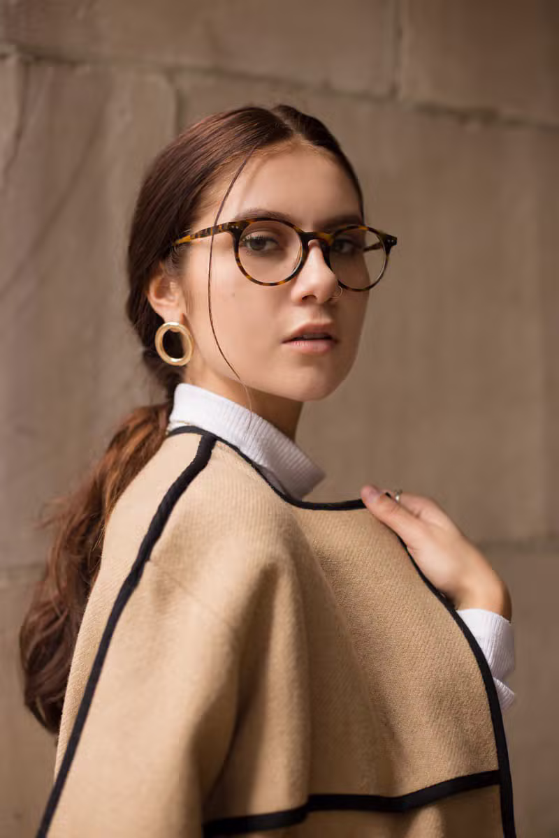 Model wearing a classic camel wool coat